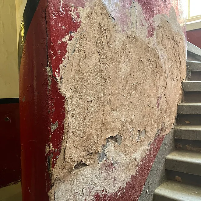 Glasgow tenement showing communal stairs disrepair and weathering