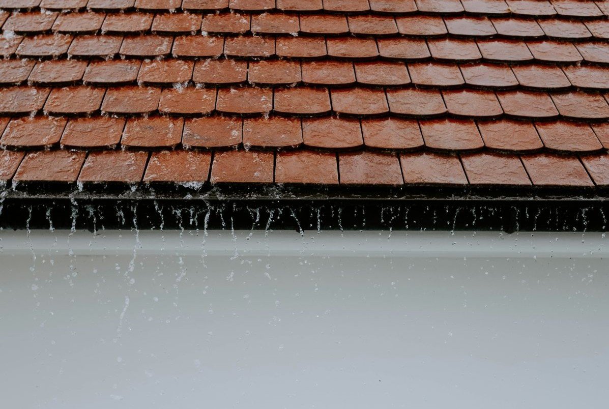 Heavy rainfall into gutter from tiled roof