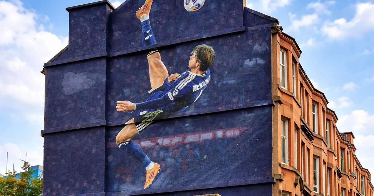 Scott McTominay overhead-kick mural on a Glasgow tenement gable end