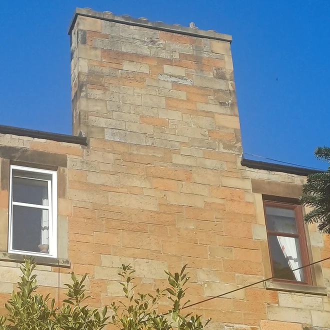 Pre-1919 tenement chimney stack showing variety of sandstone types