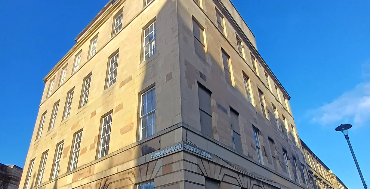 Sash and case window open to allow ventilation in a tenement flat